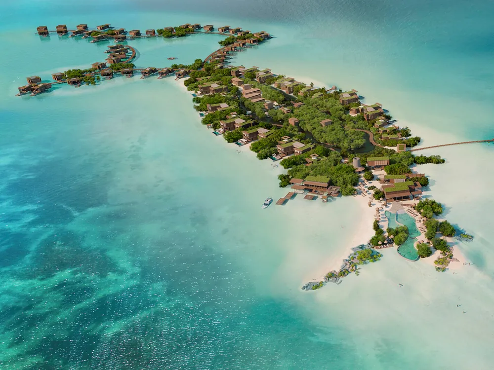 Aerial view of the Six Senses resort island with overwater villas in Belize